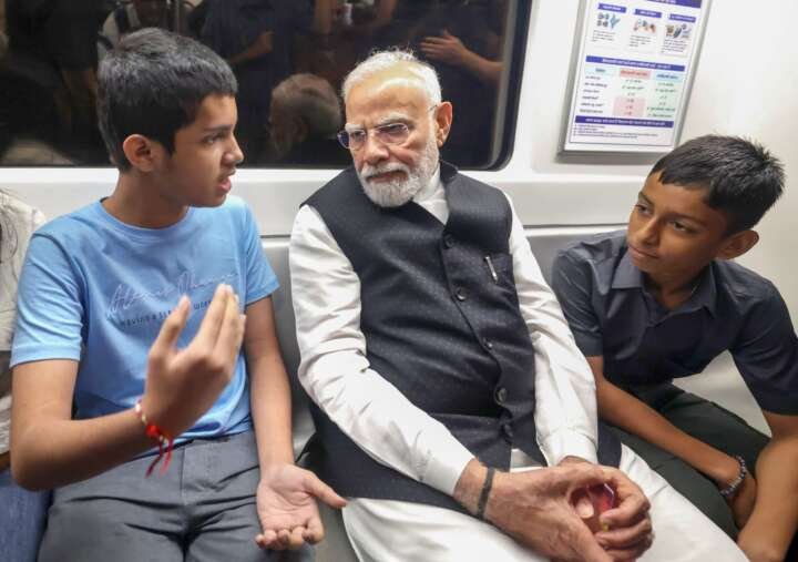 PM Modi’s ride in Delhi Metro happily surprises children, co-passengers..